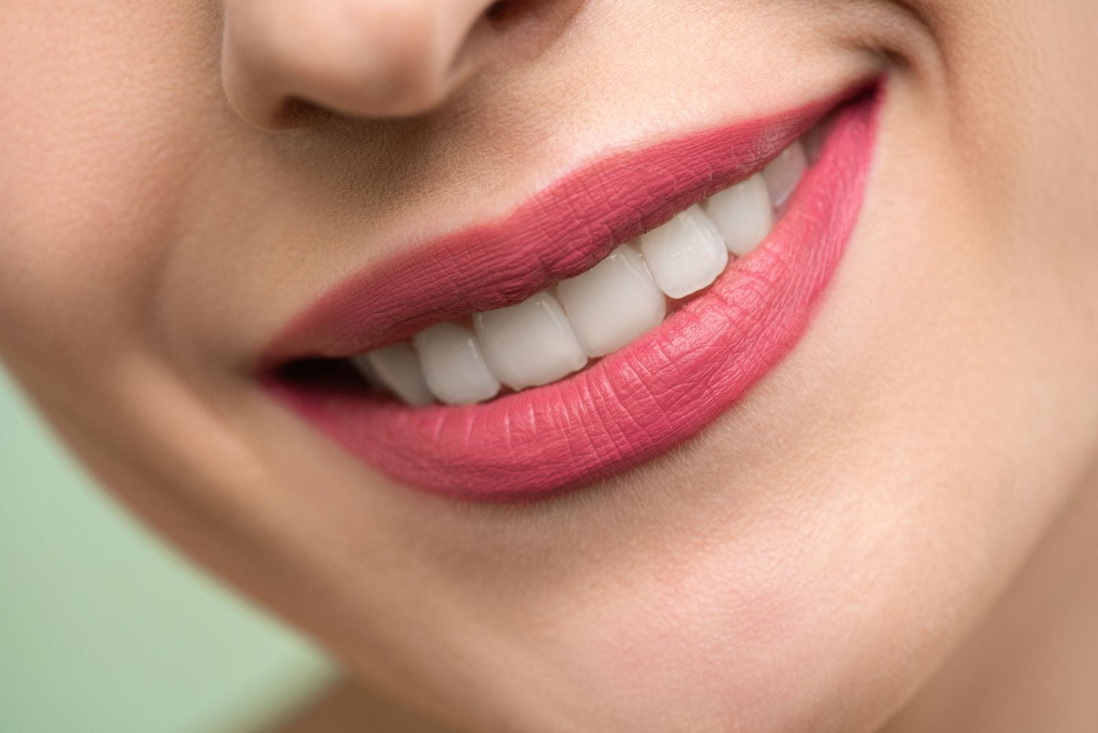 Close view of a bright, considered smile